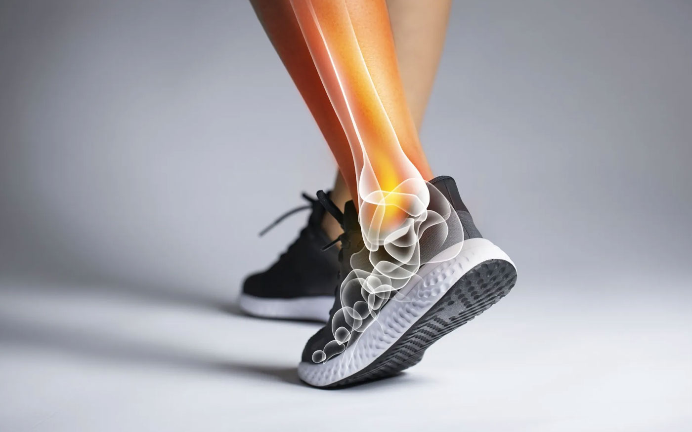 diagram of ankle joins over photo of person in athletic shoes